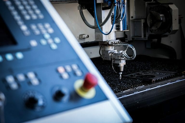 Laser cutting machine with console in the foreground