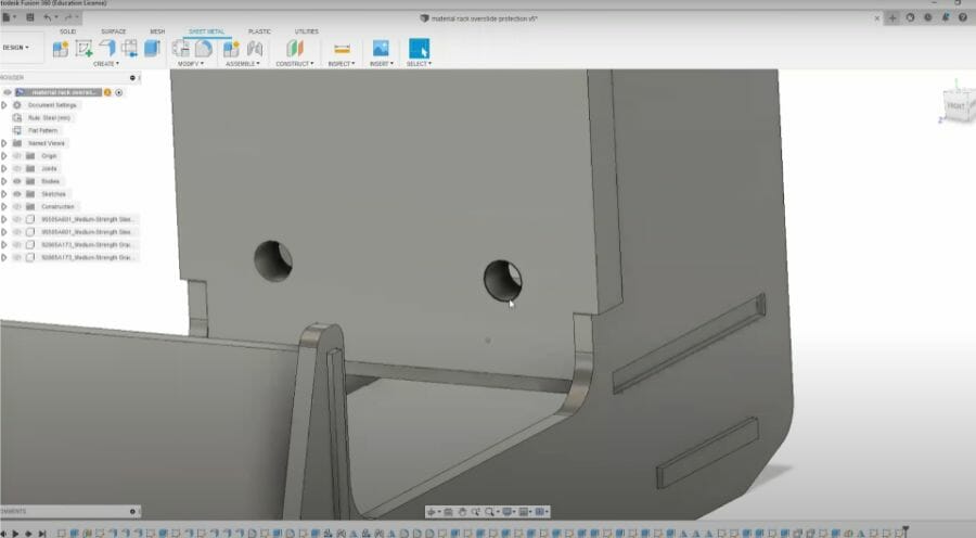 Screenshot of a part modeled in Autodesk Fusion with two 1/4-20 holes prepped for tapping