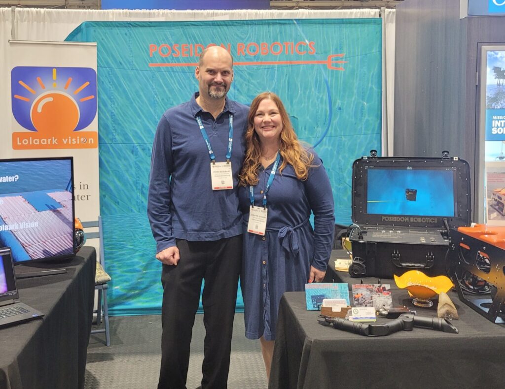 Peter and Christine Schubert displaying their underwater ROV at a tradeshow