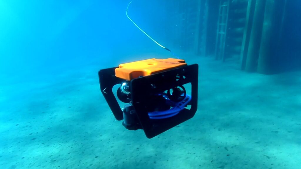 Poseidon Robotics custom ROV submerged, built with SendCutSend laser-cut anodized aluminum